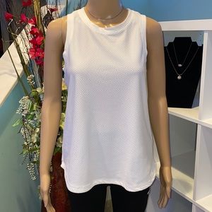 Like new condition! White, athletic tank top with fabric detailing.